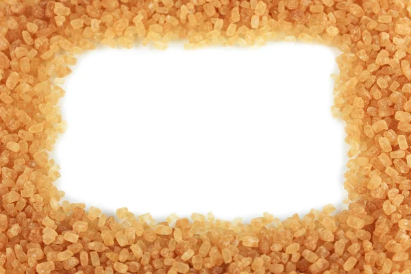Bruine suiker op witte achtergrond — Stockfoto