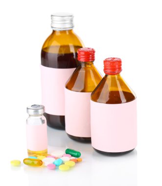 Pills and medicine bottles isolated on white clipart