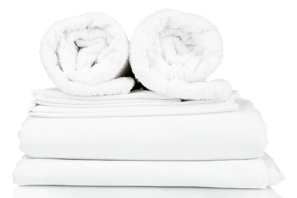 Stack of clean bedding sheets isolated on white — Stock Photo, Image