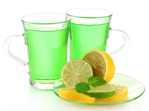 Due tazze trasparenti di tè verde con menta e limone isolato su bianco — Foto Stock