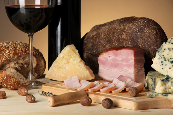 Exquisite still life of wine, cheese and meat products
