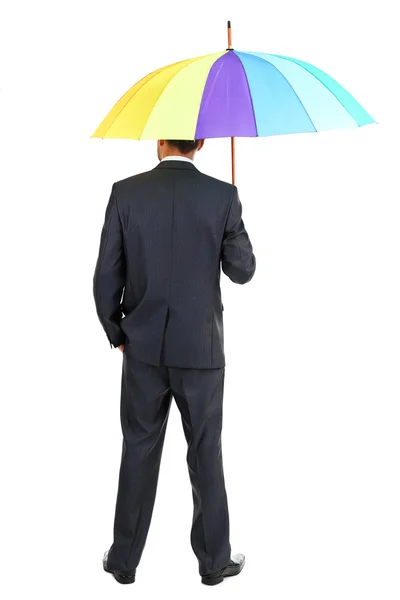 Businessman with multicolor umbrella, isolated on white — Stock Photo, Image