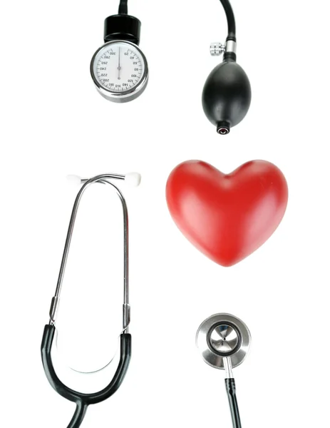 Tonometer, stethoscope and heart isolated on white — Stock Photo, Image