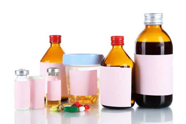 Pills and medicine bottles isolated on white — Stock Photo, Image