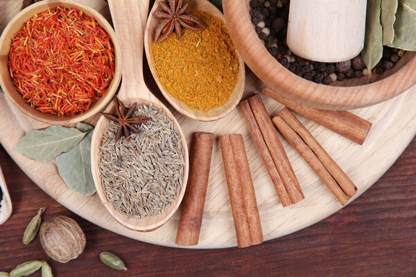 Various spices and herbs on wooden table