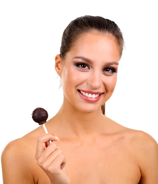Portrait of beautiful young girl with chocolate candy isolated on white — Stock Photo, Image