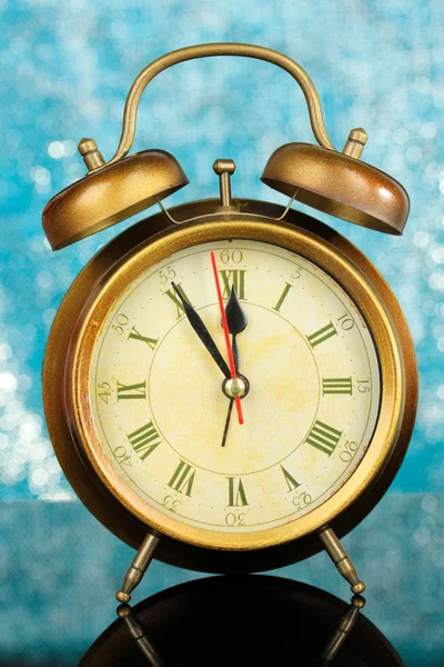 Gold clock on bright background — Stock Photo, Image