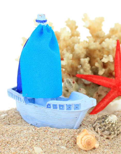 Blue toy ship on sand isolated on white — Stock Photo, Image