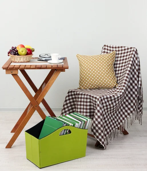 Magazines and folders in green box on table in room — Stock Photo, Image