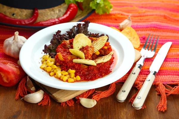 Chili Corn Carne - traditional mexican food, on white plate, on napkin, on wooden background — Stock Photo, Image