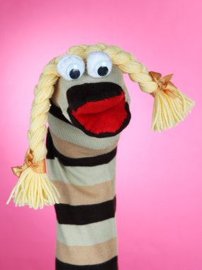 pembe bir arka plan üzerinde şirin çorap kukla