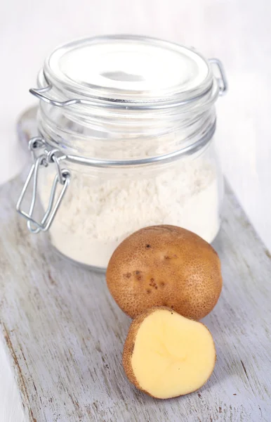 Starch in bank on wooden table close-up — Stock Photo, Image