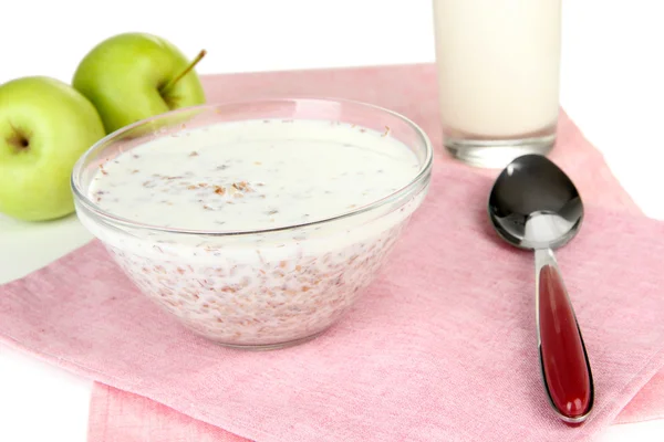 Gachas de trigo sarraceno con leche en servilleta aislada en blanco —  Fotos de Stock