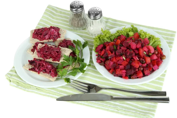 Beet salad on toasts and on plate isolated on white — Stock Photo, Image