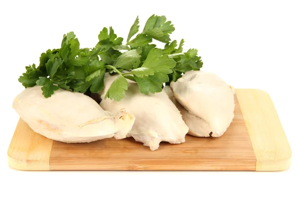 Boiled chicken breast on wooden cutting board with parsley isolated on white — Stock Photo, Image