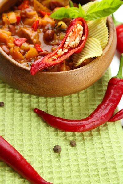 Chili Corn Carne - traditional mexican food, in wooden bowl, on napkin, close up — Stock Photo, Image
