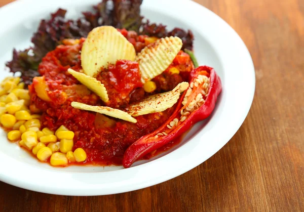 Chili Corn Carne - traditional mexican food, on white plate, on napkin, on wooden background — Stock Photo, Image