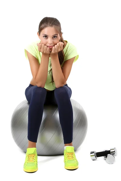 Joven hermosa chica fitness con bola gris aislado en blanco — Foto de Stock