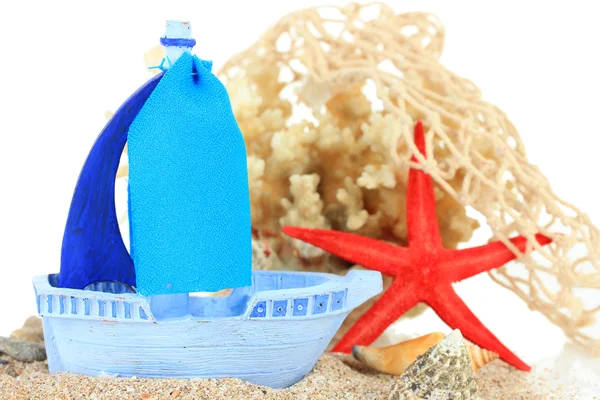 Blue toy ship on sand isolated on white — Stock Photo, Image