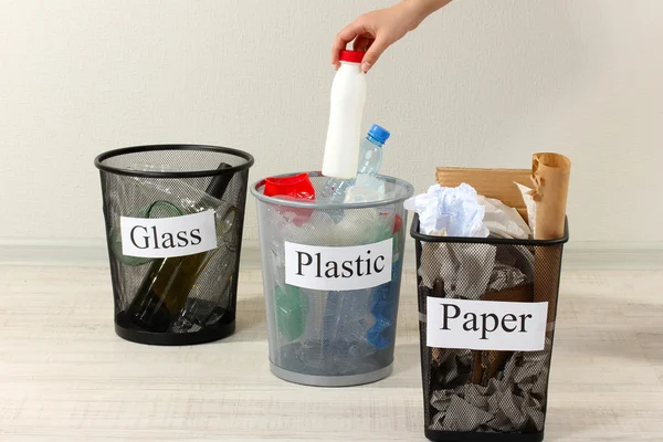 Three buckets of assorted debris on room background — Stock Photo, Image