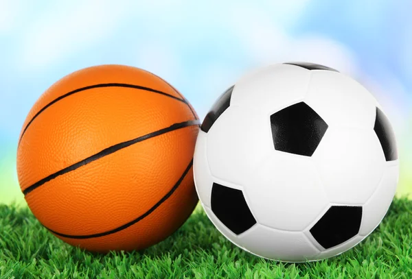 Sport balls, on green grass, on bright background — Stock Photo, Image