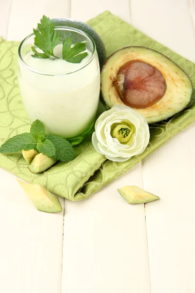 Fresh avocado smoothie on wooden background — Stock Photo, Image