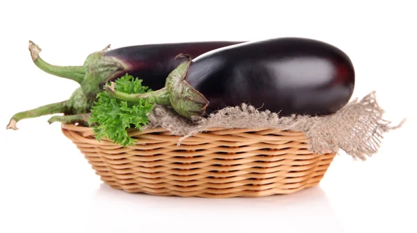 Fresh eggplants in wicker basket isolated on white — Stock Photo, Image