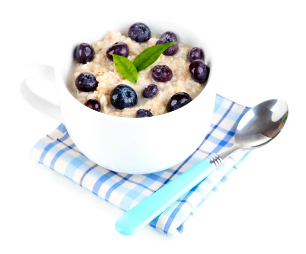 Oatmeal in cup with berries isolated on white — Stock Photo, Image