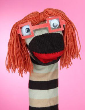 pembe bir arka plan üzerinde şirin çorap kukla