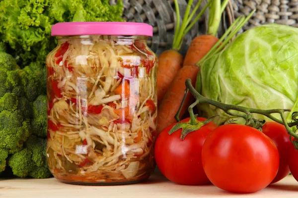 Fresh vegetables and canned on wooden table close up — Stock Photo, Image