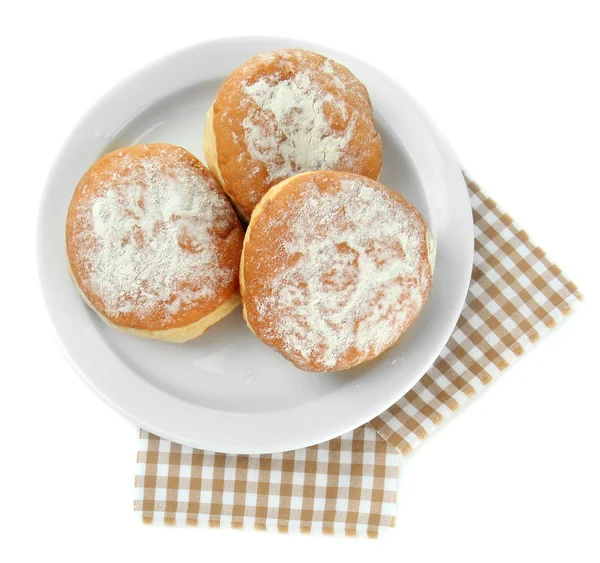 Вкусные пончики на тарелке, изолированные на белом — стоковое фото