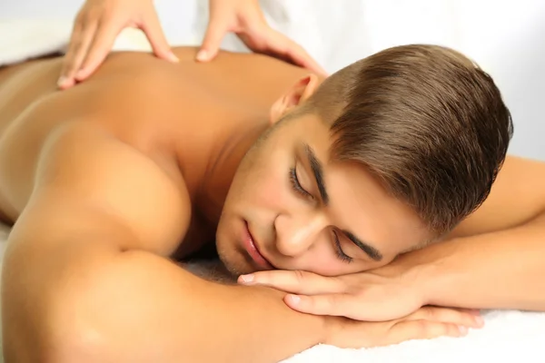 Young man having back massage close up — Stock Photo, Image