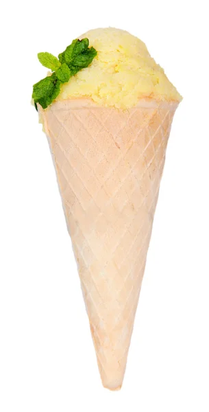 Appetizing yellow ice cream with mint in waffle cone isolated on white — Stock Photo, Image