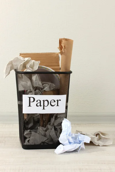 Assorted trash in bucket on room background — Stock Photo, Image