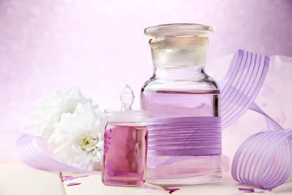 Glass bottles with color essence, on light background — Stock Photo, Image