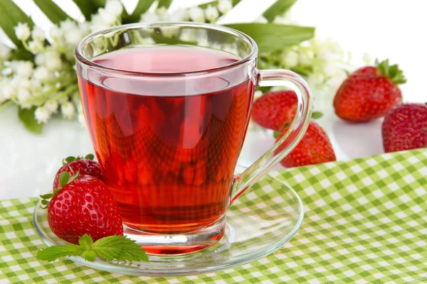Delicious strawberry tea on table on white background — Stock Photo, Image