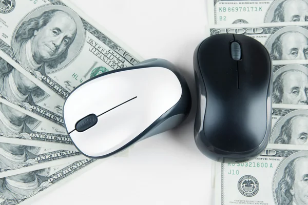 Computer mouses on dollars close up — Stock Photo, Image