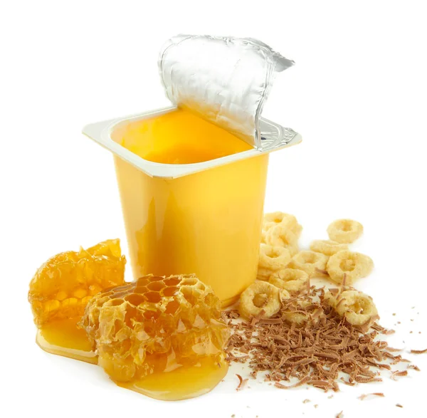 Tasty dessert in open plastic cup and honey combs, isolated on white — Stock Photo, Image