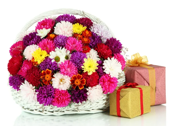 Beautiful bouquet of chrysanthemums in wicker basket isolated on white — Stock Photo, Image