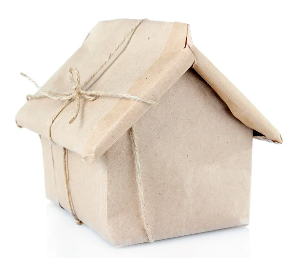 House wrapped in brown kraft paper, isolated on white — Stock Photo, Image