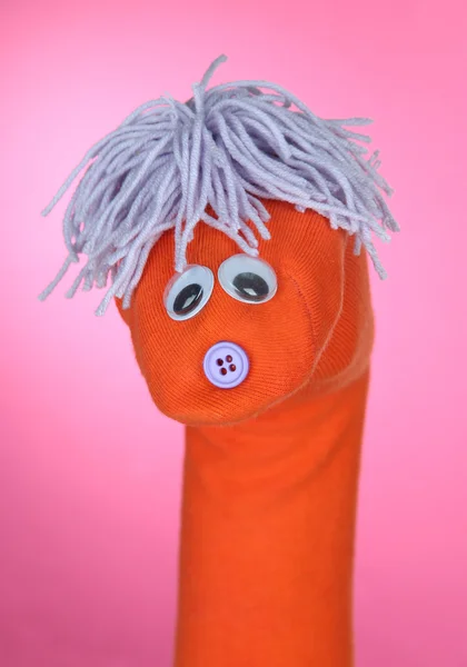Cute sock puppet on pink background — Stock Photo, Image