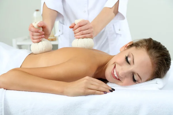 Beautiful young woman having back massage close up — Stock Photo, Image