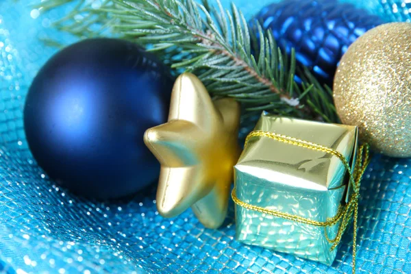 Beautiful Christmas decor on blue cloth — Stock Photo, Image