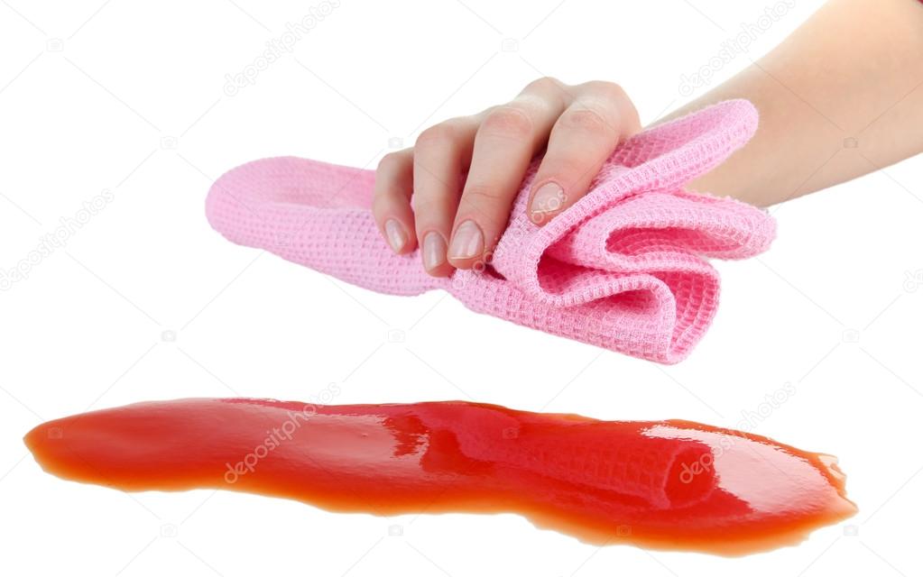 Hand wiping surface with pink rag isolated on white