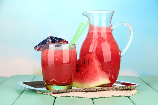 Glass of fresh watermelon juice, on wooden table, on bright background — Stock Photo, Image