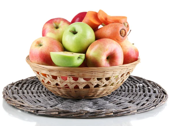 Sweet apples and carrots in basket isolated on white — Stockfoto