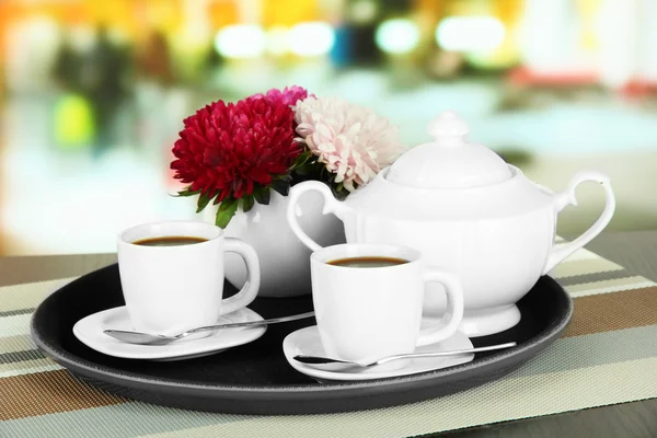 Cups of coffee on tray on table in cafe — Stock Photo, Image