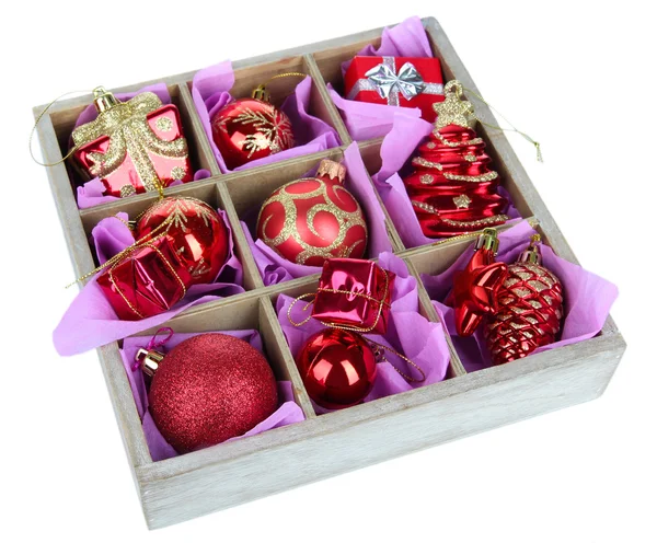 Christmas toys in wooden box isolated on white — Stock Photo, Image