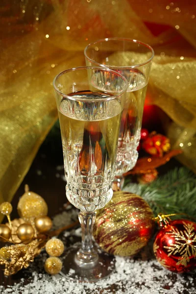 Composition with Christmas decorations and two champagne glasses, on bright background — Stock Photo, Image