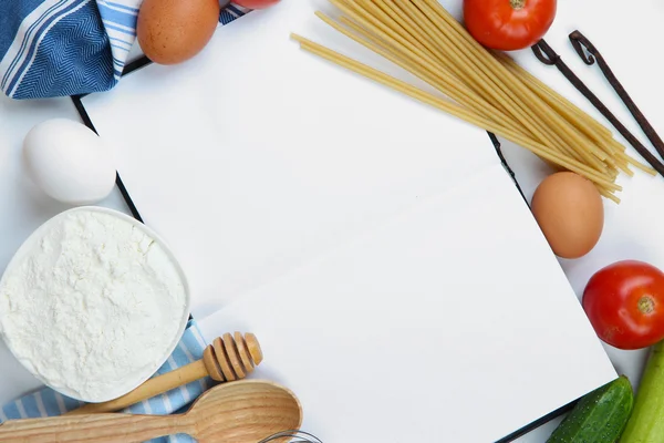 Cooking concept. Groceries with empty cookbook close up — Stock Photo, Image